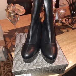 A bootie black  and silver rimestone heels Wedge,